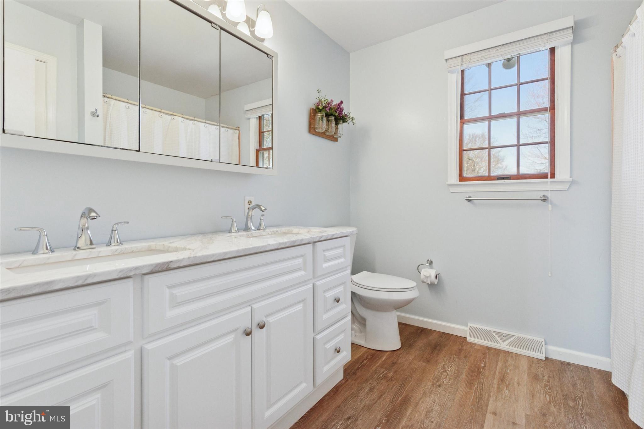 1481 Independence Way Hatfield, PA 19440 - Photo 20 of 35 a bathroom with a sink a toilet and a window