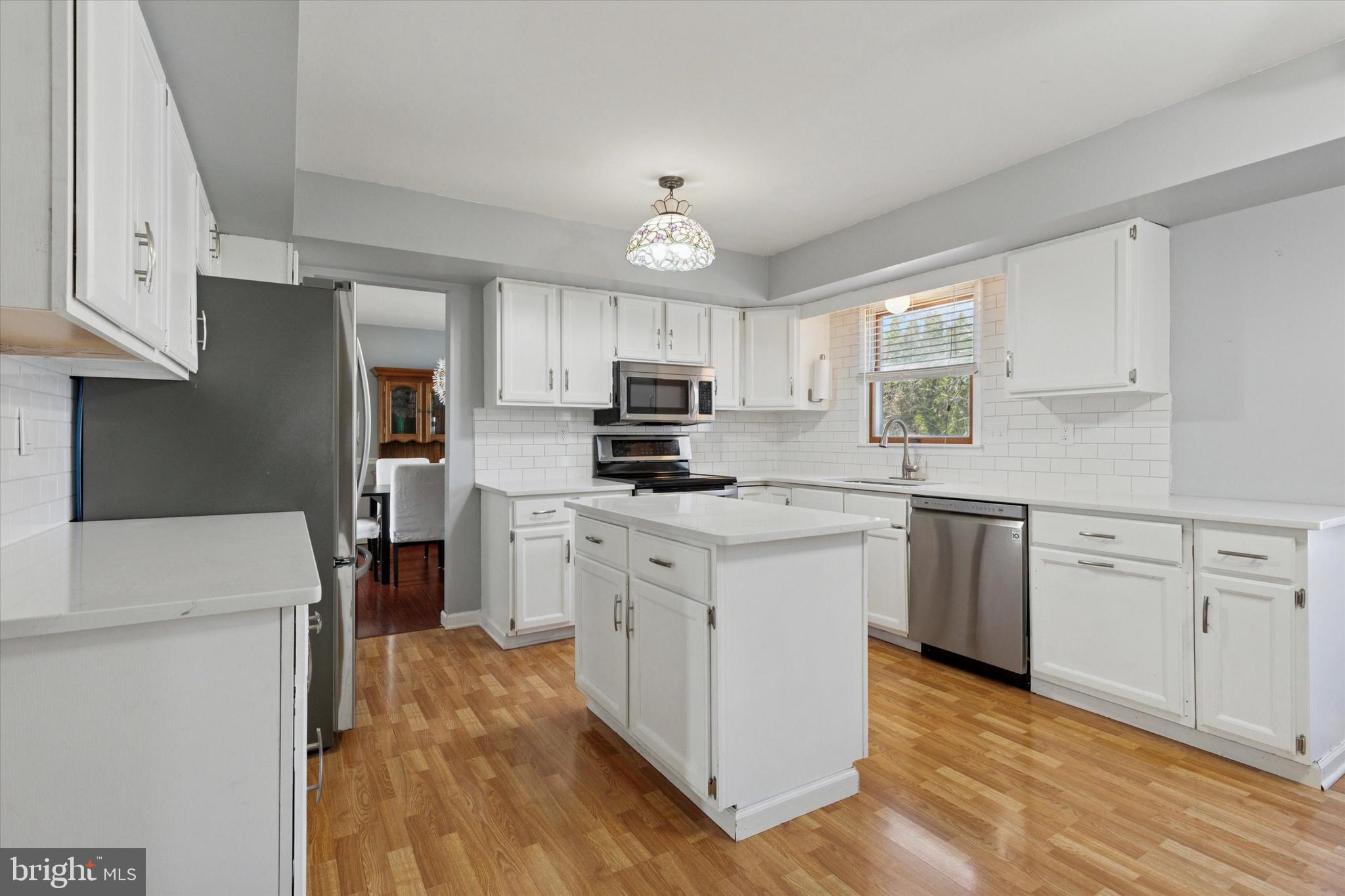 1481 Independence Way Hatfield, PA 19440 - Photo 3 of 35 a kitchen with granite countertop white cabinets and white appliances