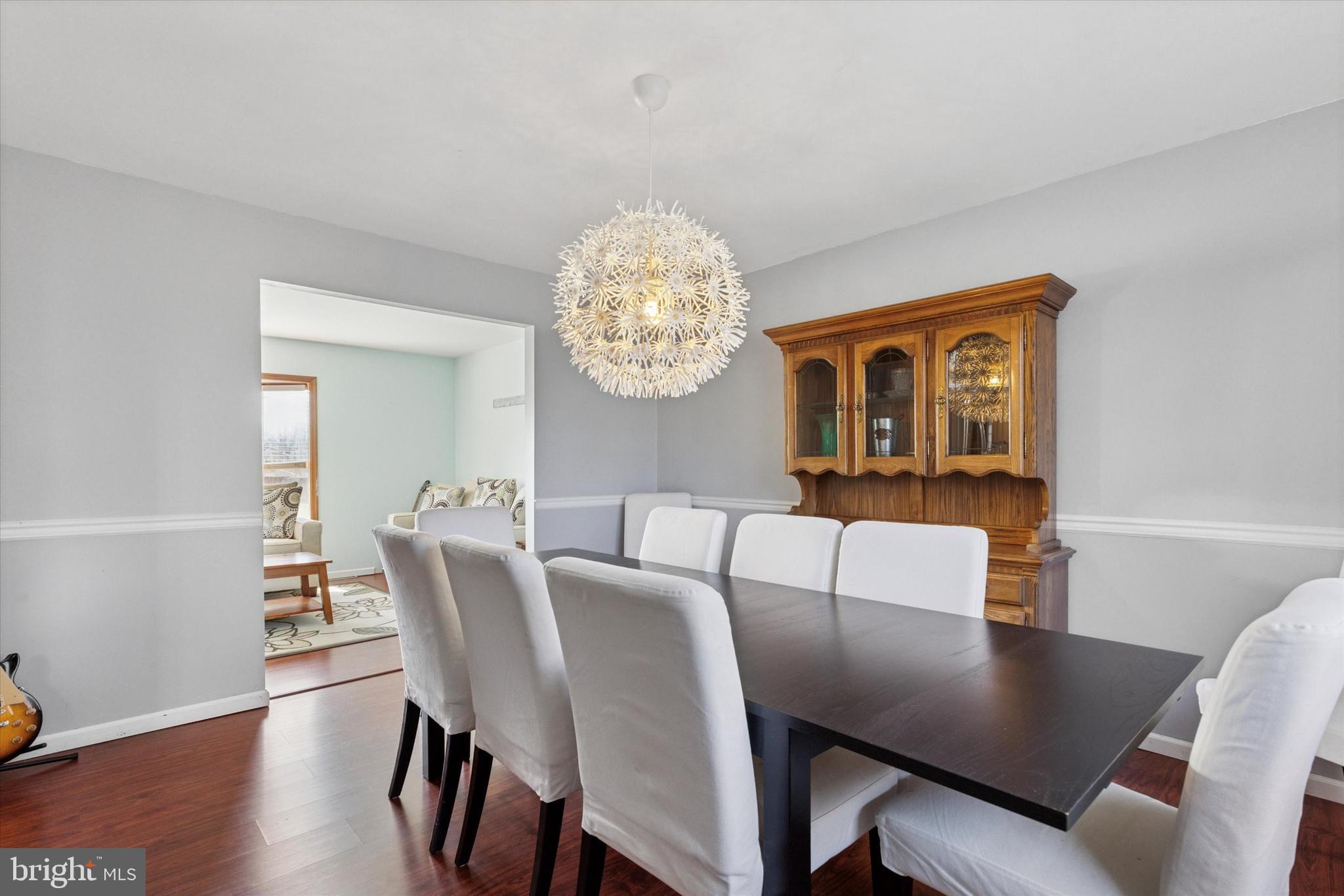 1481 Independence Way Hatfield, PA 19440 - Photo 6 of 35 a view of a dining room with furniture a chandelier and wooden floor