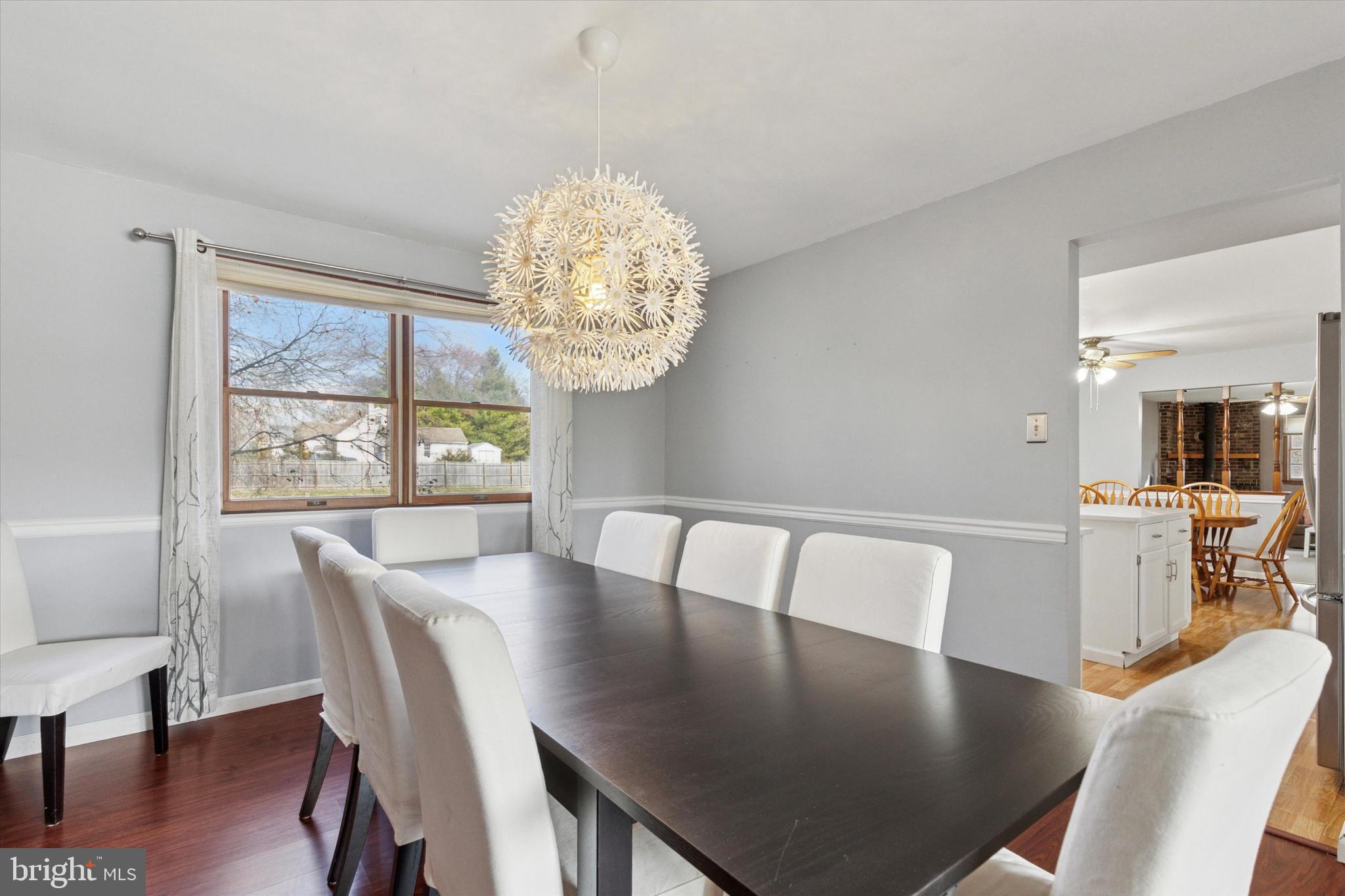 1481 Independence Way Hatfield, PA 19440 - Photo 7 of 35 a view of a dining room with furniture a chandelier and wooden floor