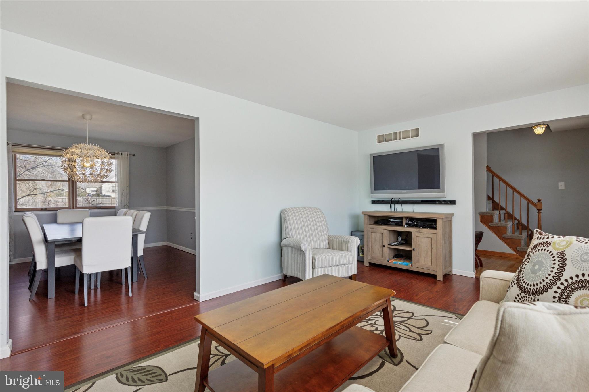 1481 Independence Way Hatfield, PA 19440 - Photo 10 of 35 a living room with furniture a rug and a dining table with wooden floor