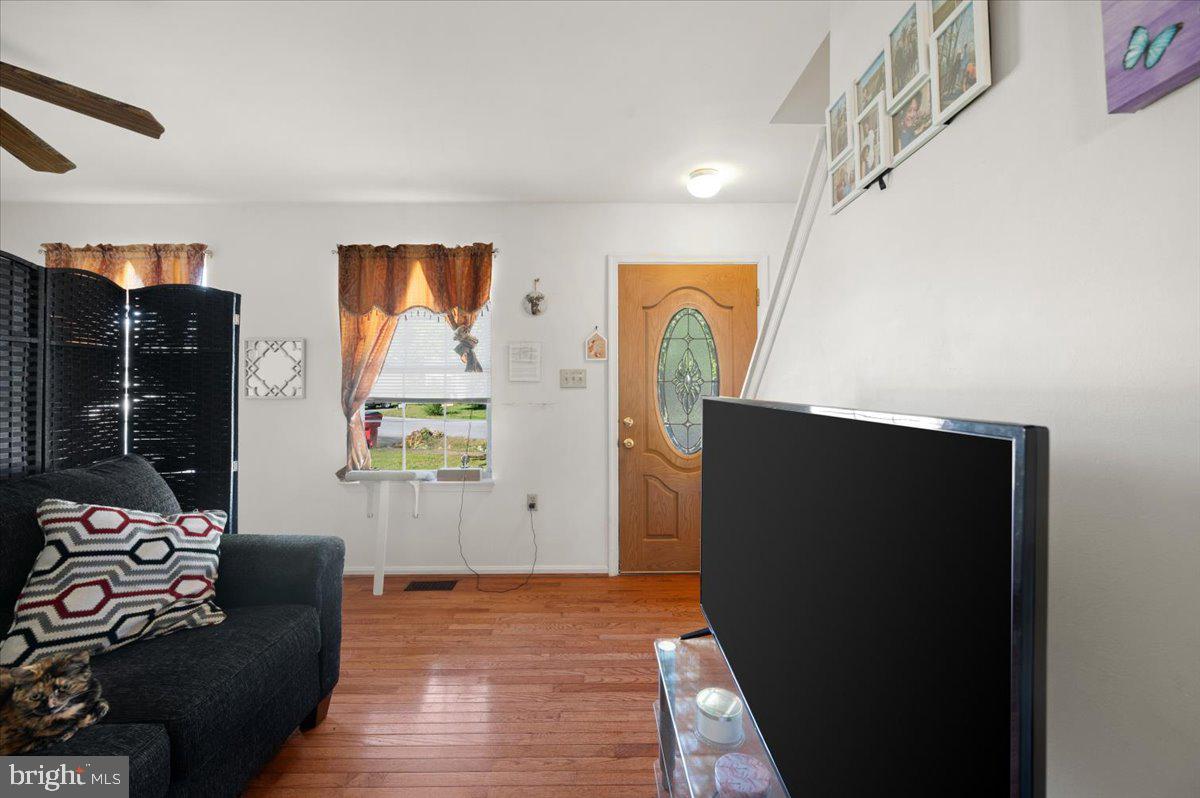 118 Ranson Estates Circle Ranson, WV 25438 - Photo 11 of 34 a living room with furniture and a window