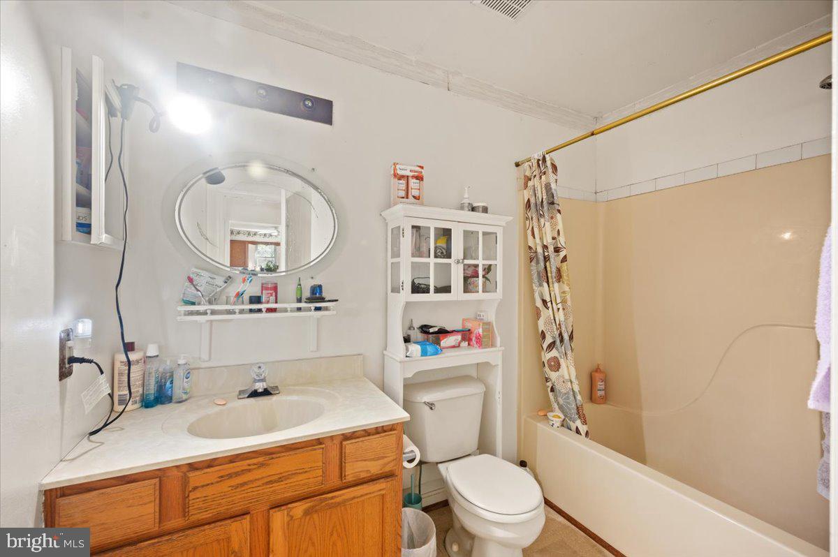 118 Ranson Estates Circle Ranson, WV 25438 - Photo 24 of 34 a bathroom with a sink vanity mirror and toilet