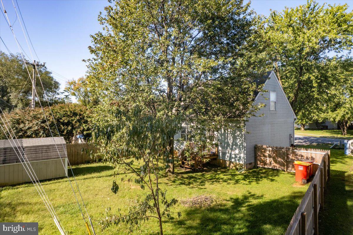 118 Ranson Estates Circle Ranson, WV 25438 - Photo 3 of 34 a backyard of a house with chairs and tree