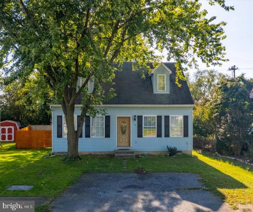 118 Ranson Estates Circle Ranson, WV 25438 - Photo 4 of 34 a front view of a house with garden