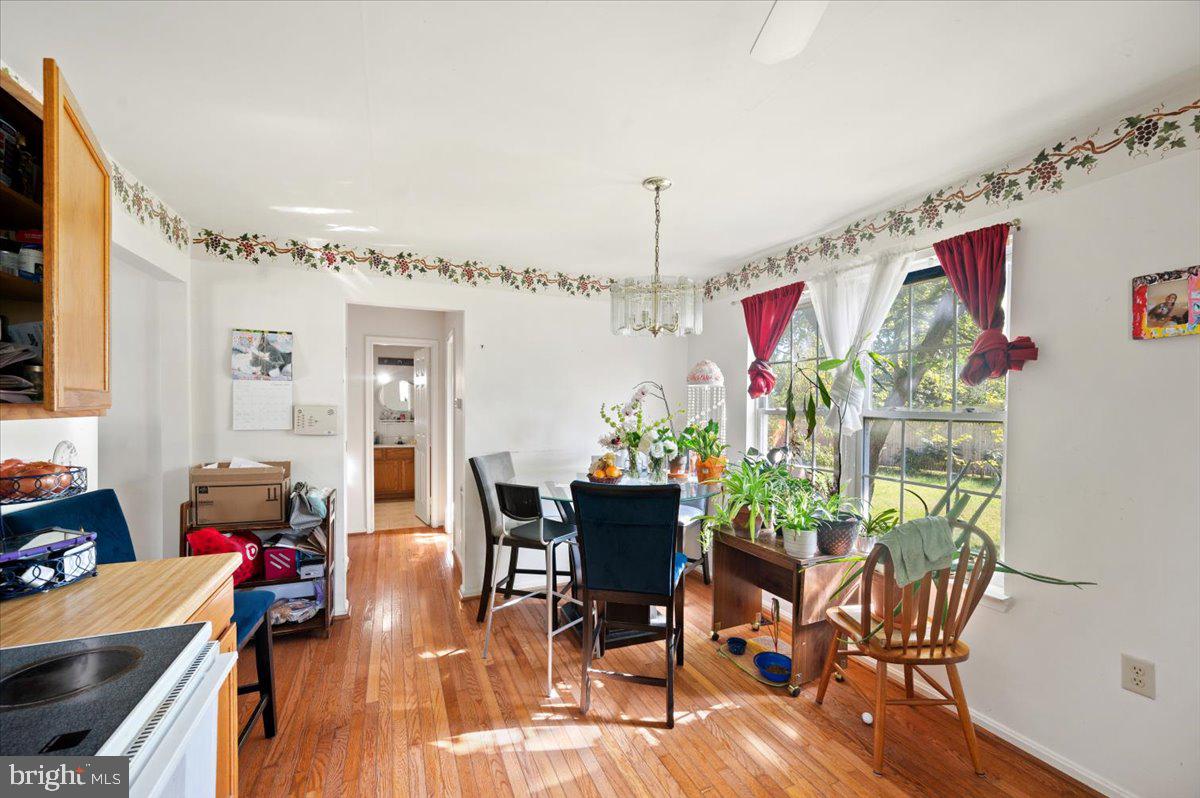 118 Ranson Estates Circle Ranson, WV 25438 - Photo 8 of 34 a view of a dining room with furniture window and wooden floor