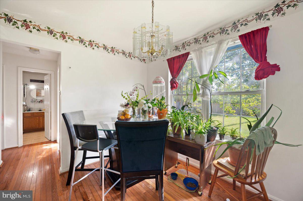 118 Ranson Estates Circle Ranson, WV 25438 - Photo 9 of 34 a view of a dining room with furniture and wooden floor