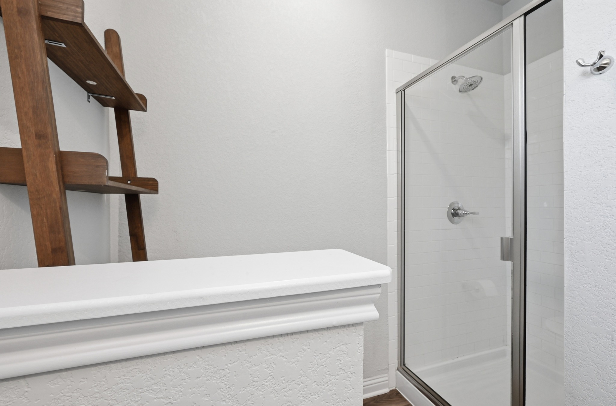 8201 Frida Bend Austin, TX 78744 - Photo 22 of 29 A spacious, naturally illuminated bathroom features a clear glass shower enclosure and sleek fixtures.