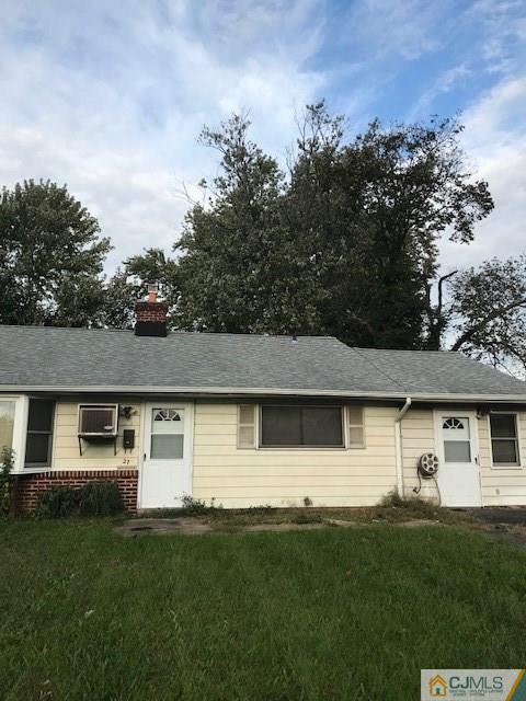27 Stony Road Edison, NJ 08817 - Photo 2 of 3 a front view of a house with a garden