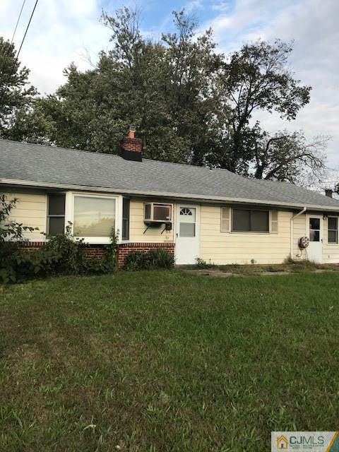 27 Stony Road Edison, NJ 08817 - Photo 3 of 3 a front view of a house with a garden