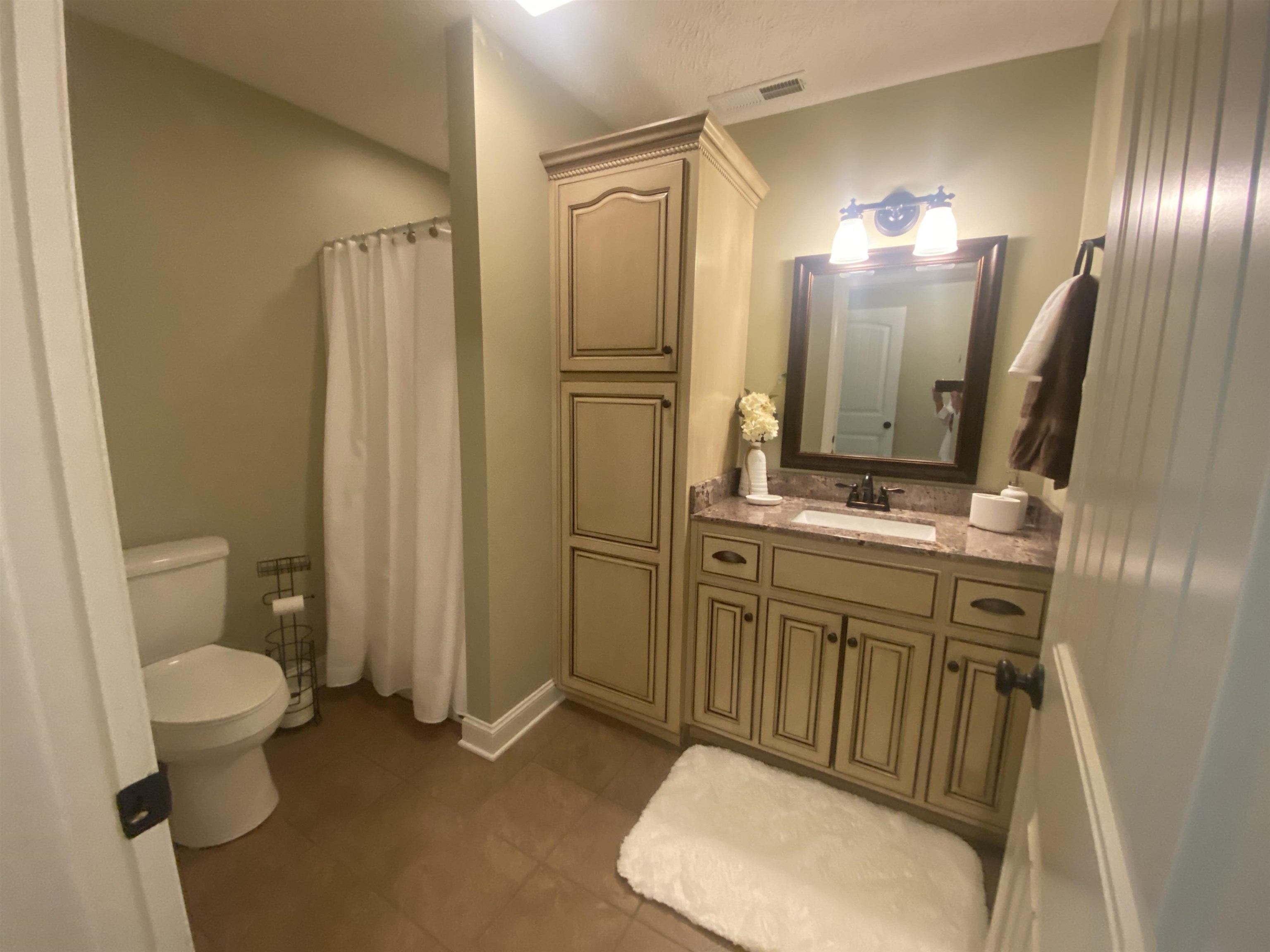 30 Masters Court Counce, TN 38326 - Photo 19 of 27 a bathroom with a sink a toilet and mirror