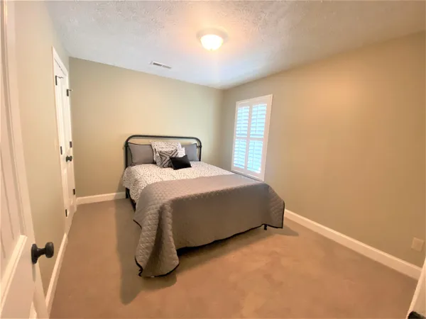 a bedroom with a bed and a cabinets