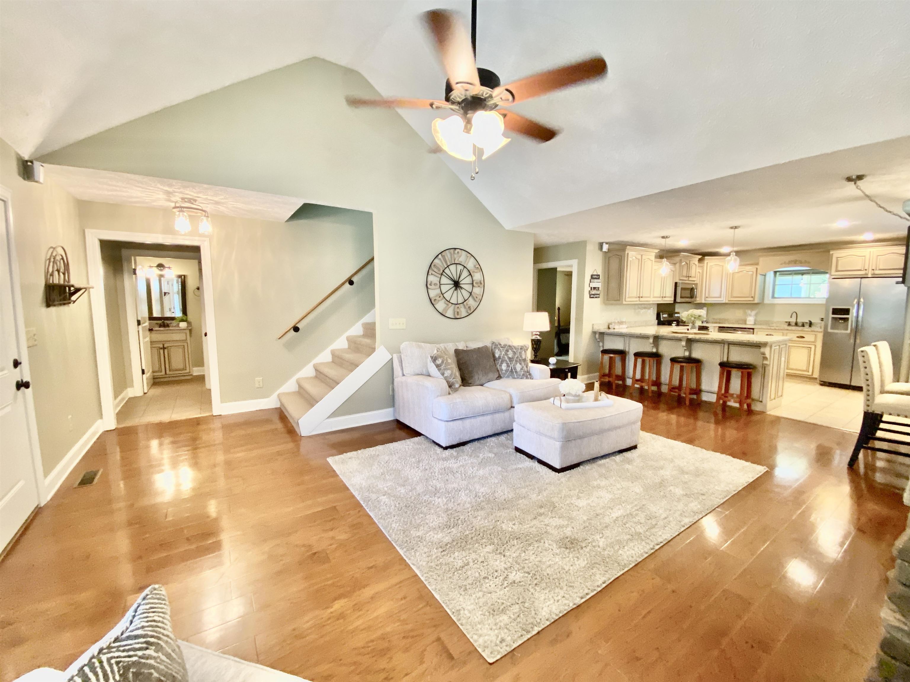 30 Masters Court Counce, TN 38326 - Photo 9 of 27 a living room with kitchen island furniture and a chandelier