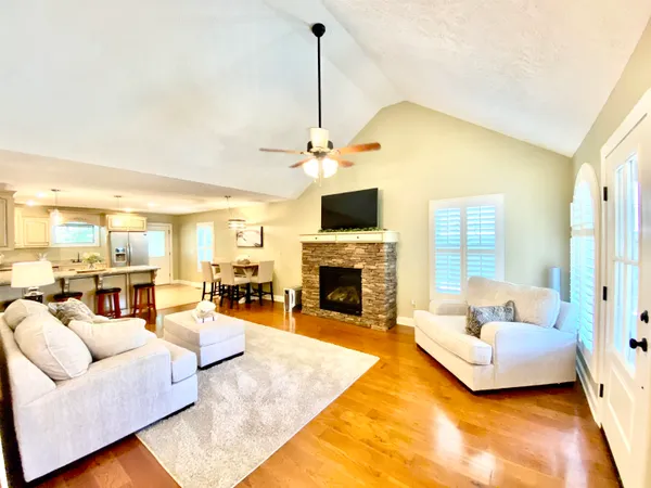 a living room with furniture and a fireplace
