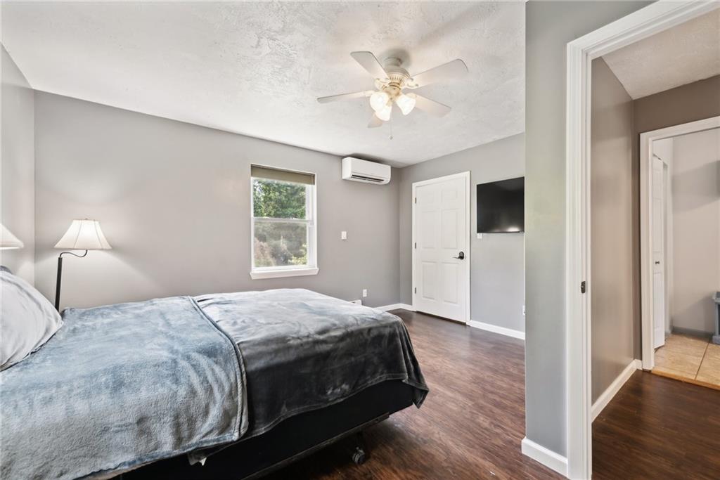 729 Athena Drive Export, PA 15632 - Photo 14 of 31 a bedroom with a bed and a chandelier