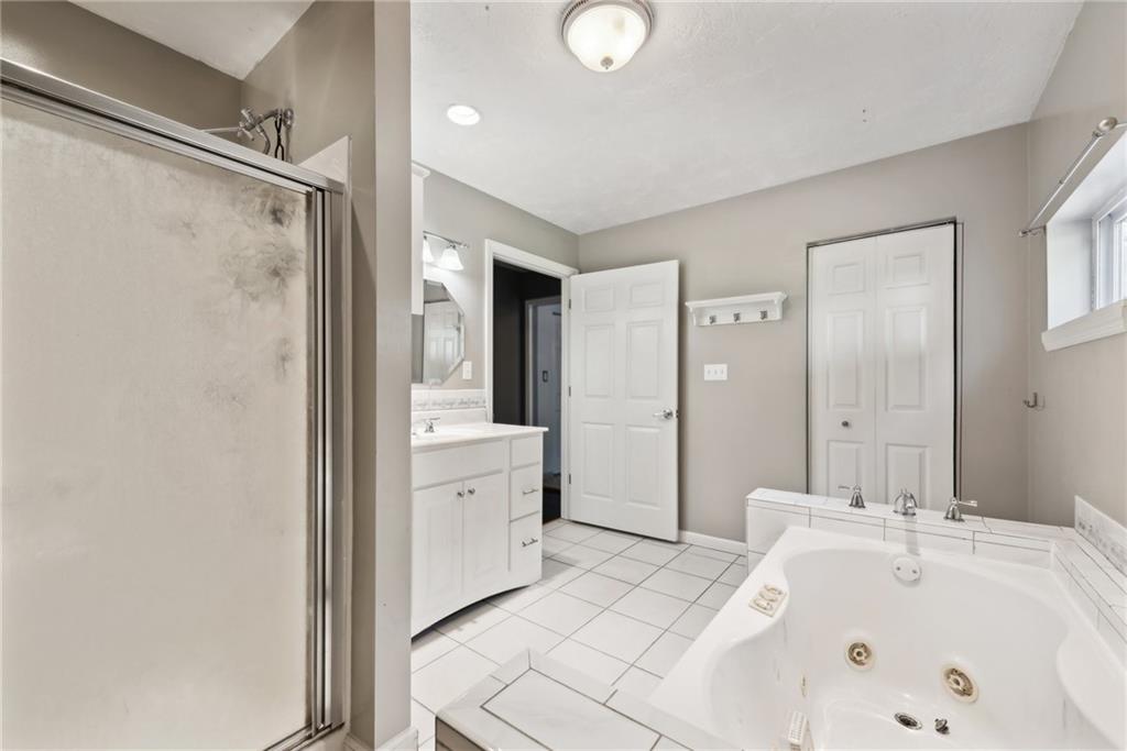 729 Athena Drive Export, PA 15632 - Photo 16 of 31 a bathroom with a tub sink and mirror