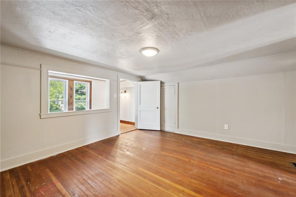 729 Athena Drive Export, PA 15632 - Photo 18 of 31 a view of an empty room with wooden floor and a window