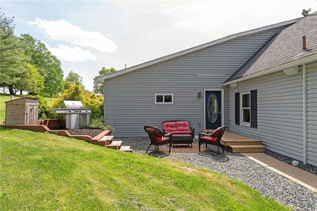 729 Athena Drive Export, PA 15632 - Photo 24 of 31 a view of a chairs and table in backyard of the house