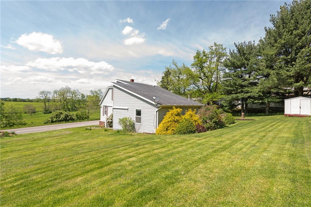 729 Athena Drive Export, PA 15632 - Photo 27 of 31 a view of a house with a yard and garage