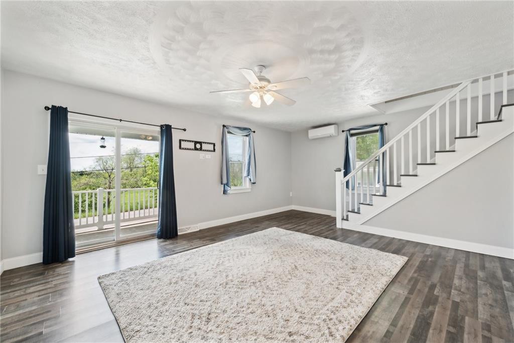 729 Athena Drive Export, PA 15632 - Photo 5 of 31 a view of an empty room with wooden floor and a window