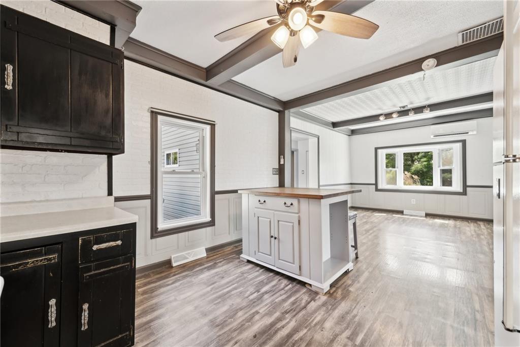 729 Athena Drive Export, PA 15632 - Photo 8 of 31 a kitchen with stainless steel appliances granite countertop a stove cabinets and wooden floor