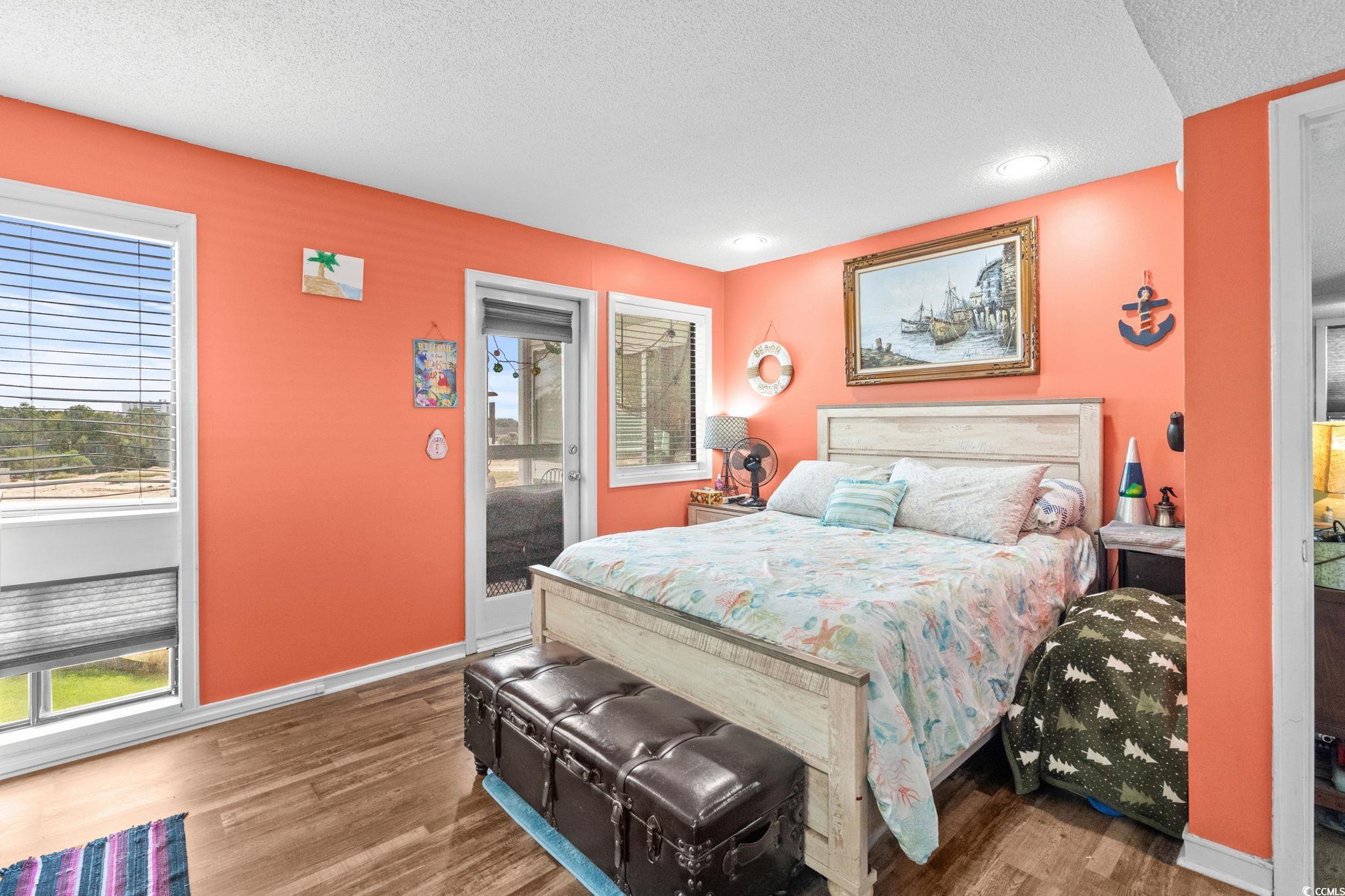 351 Lake Arrowhead Road, Unit 275 Myrtle Beach, SC 29572 - Photo 12 of 37 Bedroom with a textured ceiling, wood finished floors, and recessed lighting