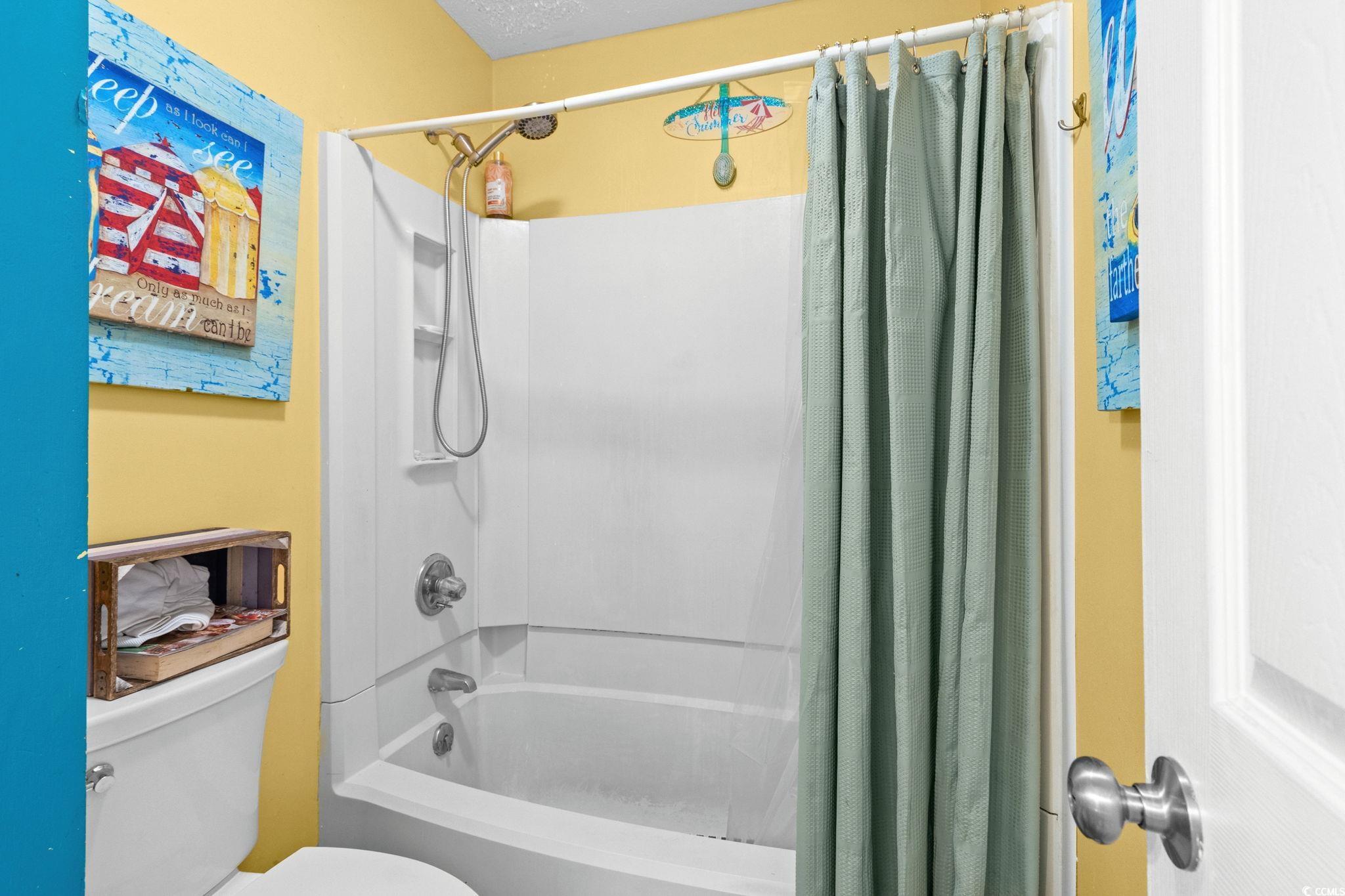 351 Lake Arrowhead Road, Unit 275 Myrtle Beach, SC 29572 - Photo 15 of 37 Full bathroom featuring shower / bath combo with shower curtain and toilet