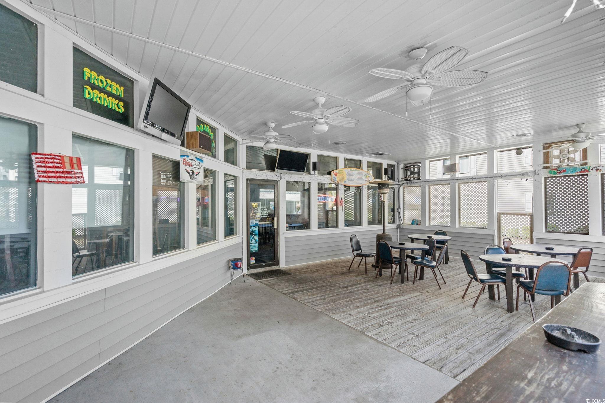 351 Lake Arrowhead Road, Unit 275 Myrtle Beach, SC 29572 - Photo 22 of 37 Sunroom / solarium with outdoor dining space and healthy amount of natural light