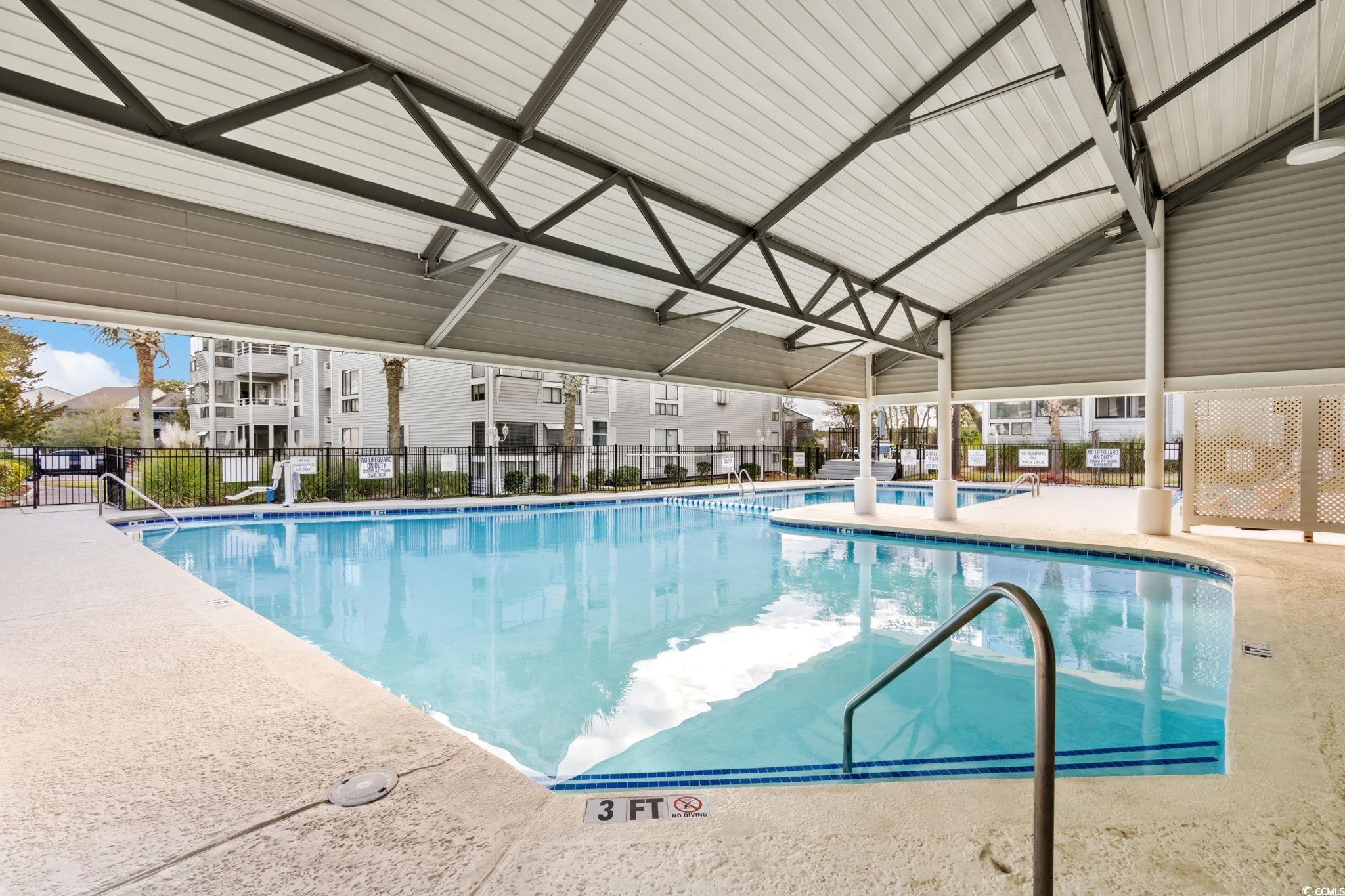 351 Lake Arrowhead Road, Unit 275 Myrtle Beach, SC 29572 - Photo 25 of 37 Indoor community pool featuring a patio