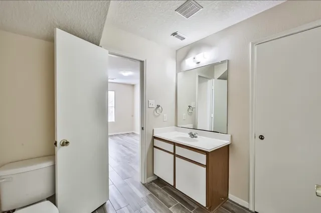 a view of kitchen with stainless steel appliances granite countertop cabinets and sink