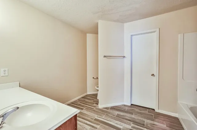 a view of a bathroom with sink and mirror
