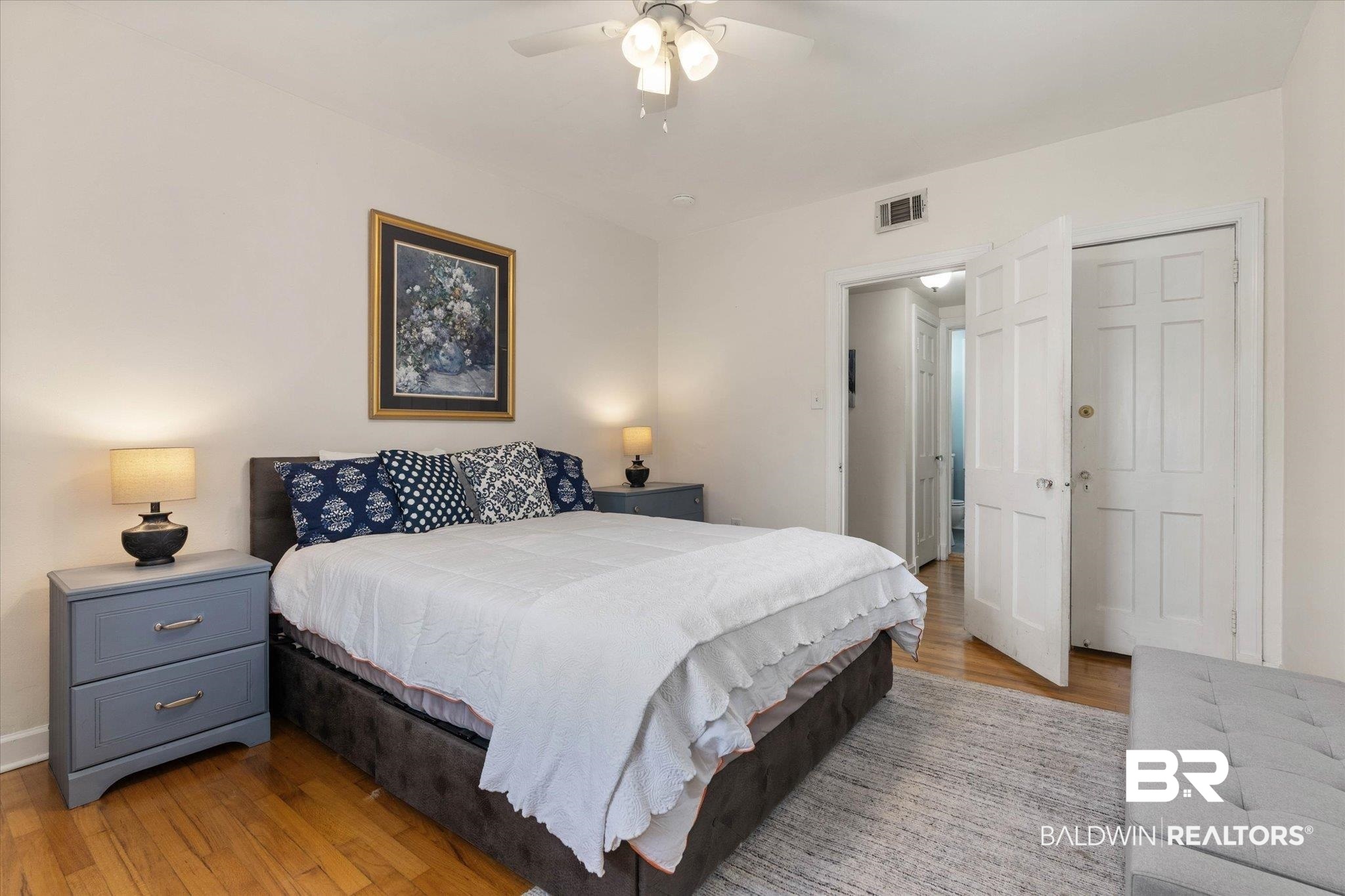 214 Upham Street, Unit 18C Mobile, AL 36607 - Photo 16 of 35 Bedroom with light wood-type flooring, baseboards, and a ceiling fan