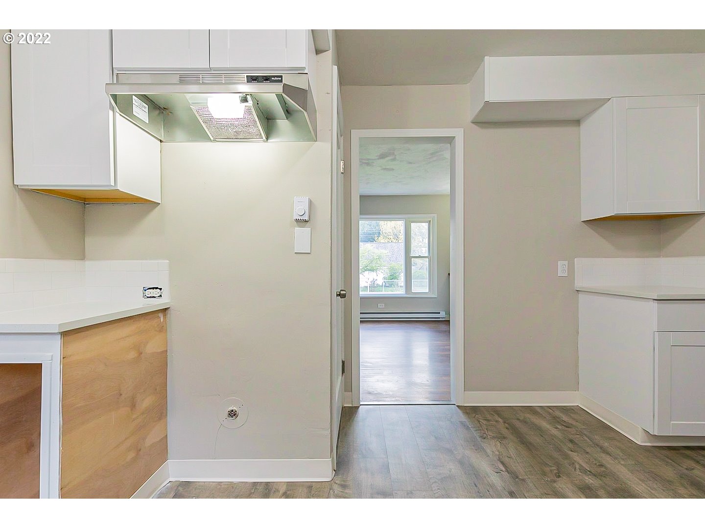 6930 Northeast Roselawn Street Portland, OR 97218 - Photo 11 of 31 a view of a kitchen from the hallway