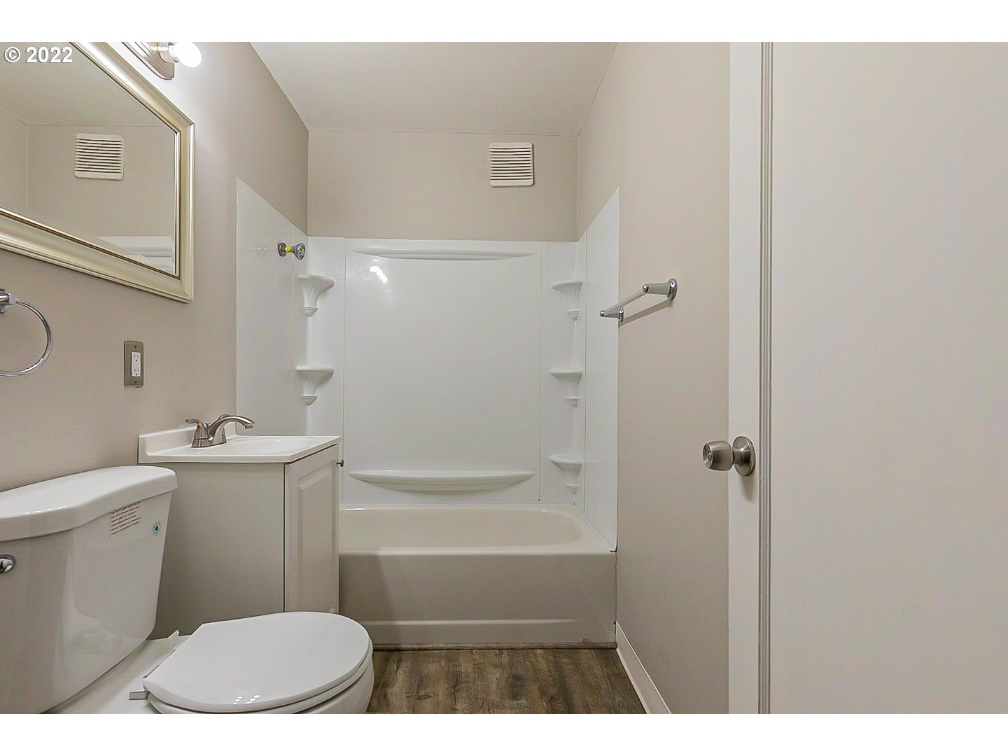 6930 Northeast Roselawn Street Portland, OR 97218 - Photo 18 of 31 a bathroom with a sink a toilet and shower