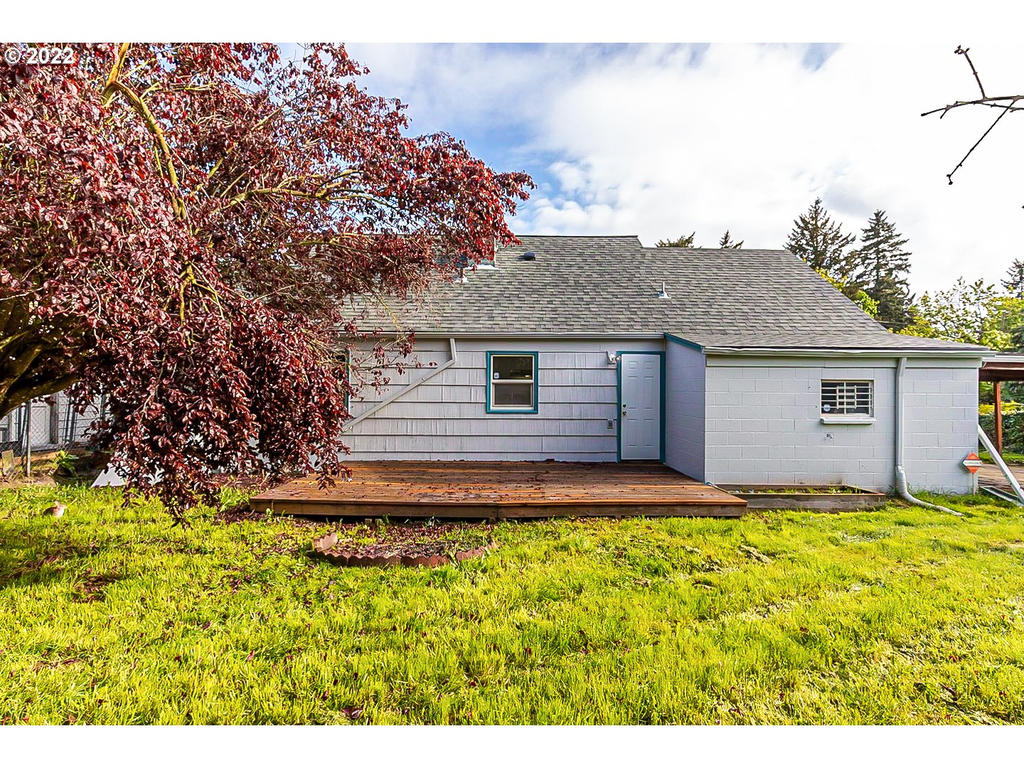 6930 Northeast Roselawn Street Portland, OR 97218 - Photo 30 of 31 a view of a house with a yard
