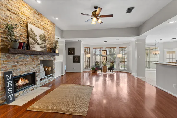 a living room with furniture and a fireplace