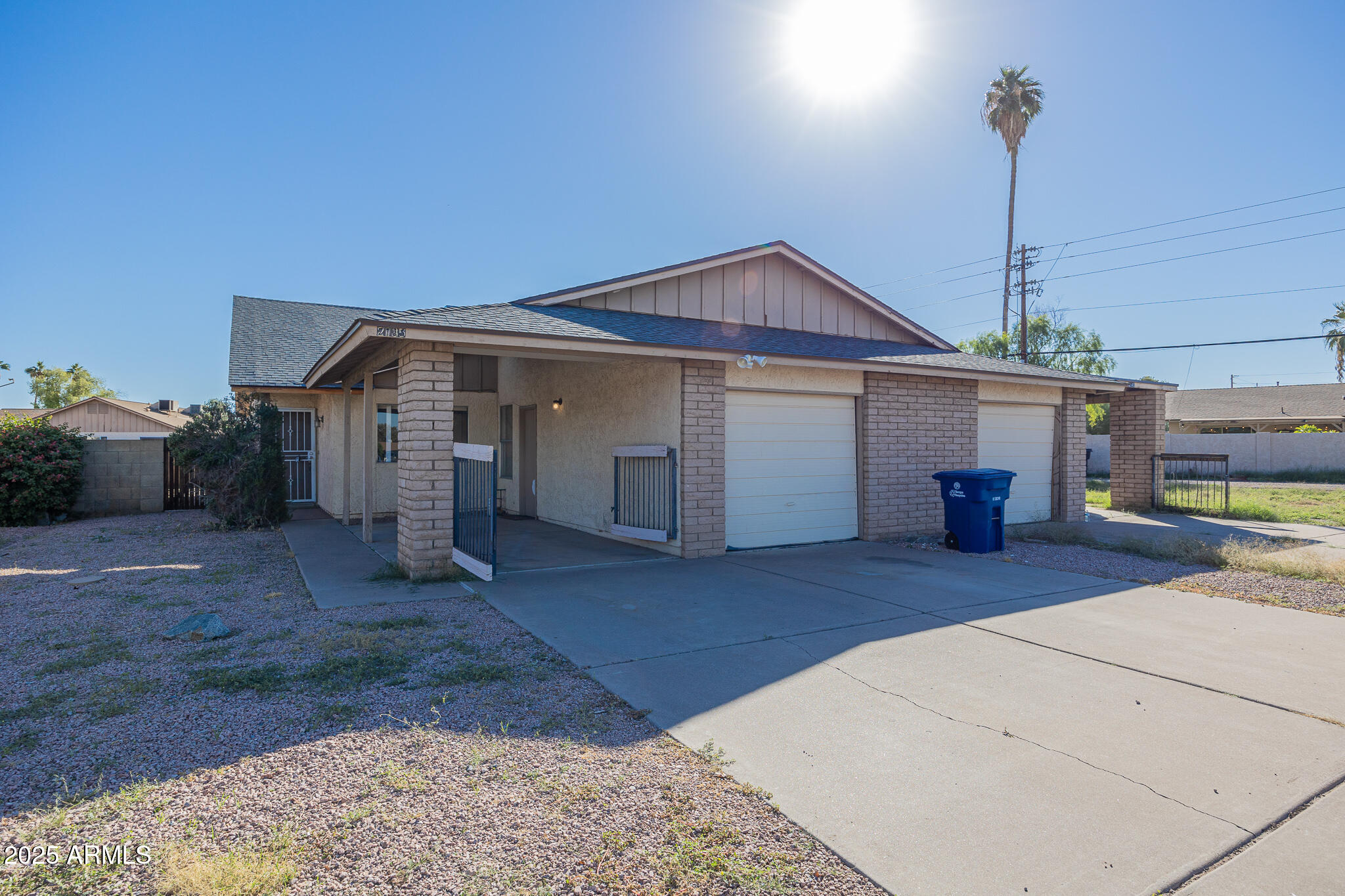 2135 South Dorsey Lane Tempe, AZ 85282 - Photo 1 of 24 a front view of a house with a yard and garage