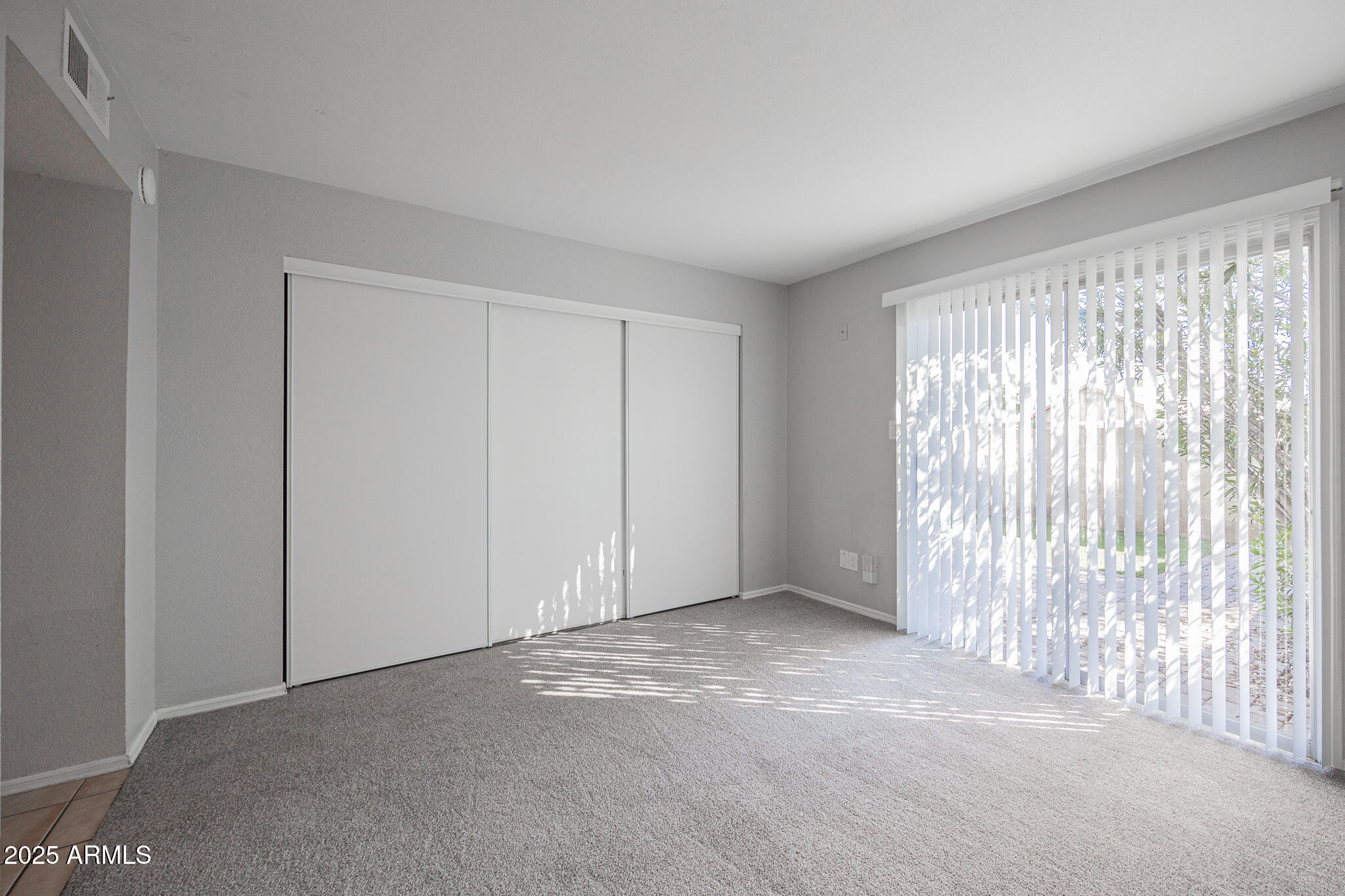 2135 South Dorsey Lane Tempe, AZ 85282 - Photo 12 of 24 a view of an empty room with a window