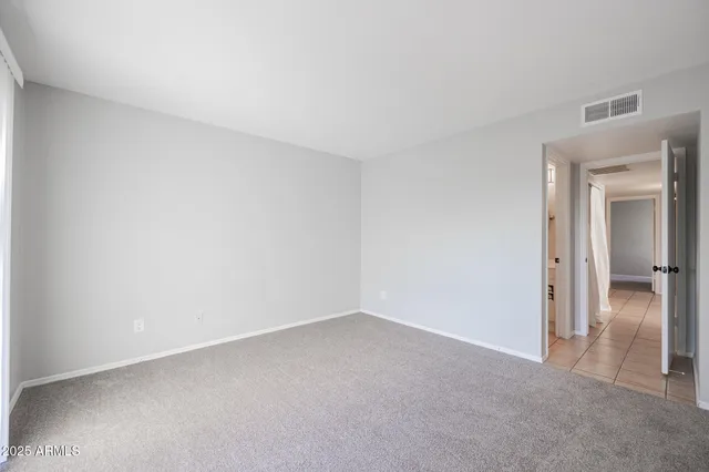 a view of an empty room and closet