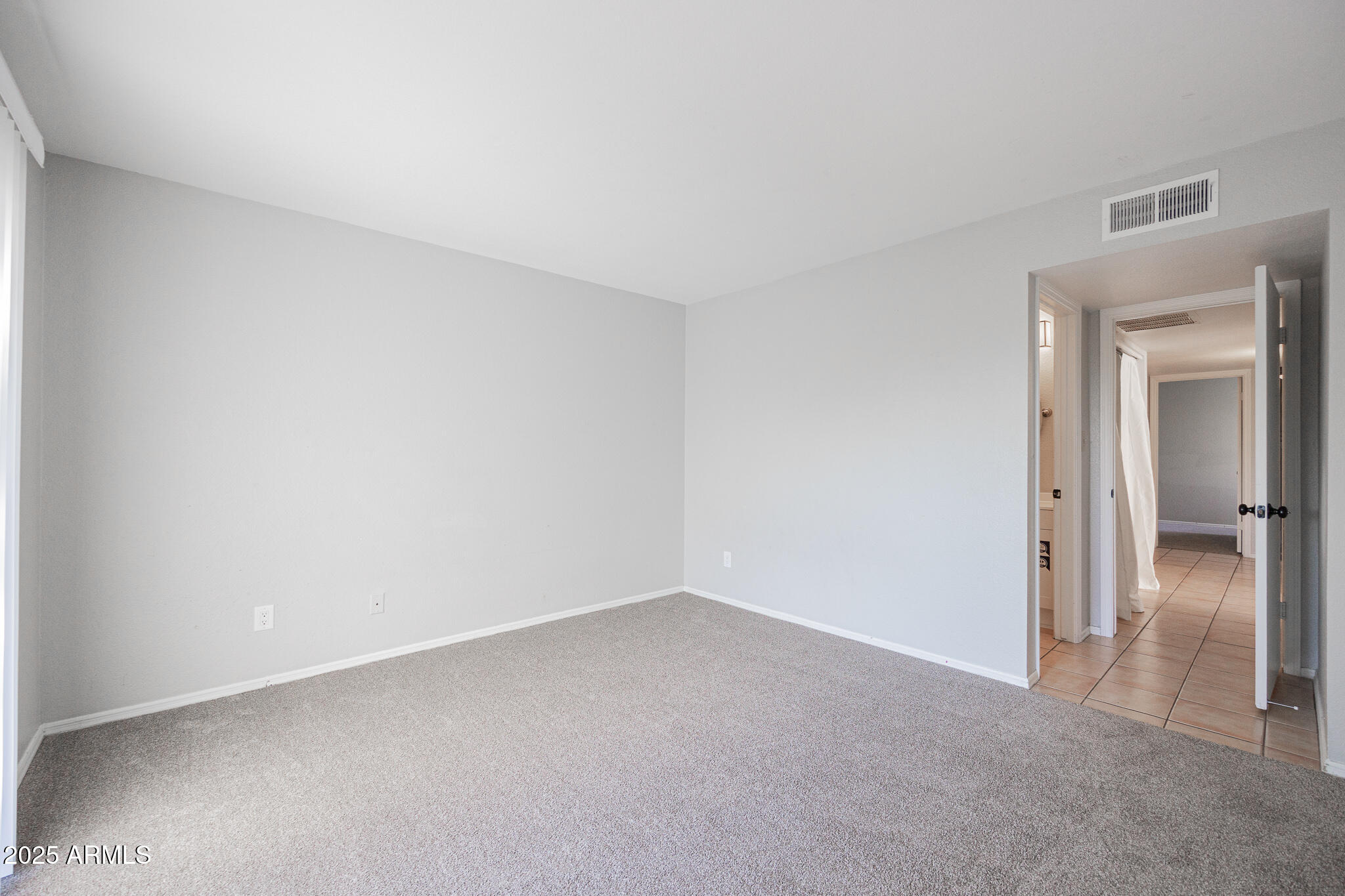 2135 South Dorsey Lane Tempe, AZ 85282 - Photo 14 of 24 a view of an empty room and closet
