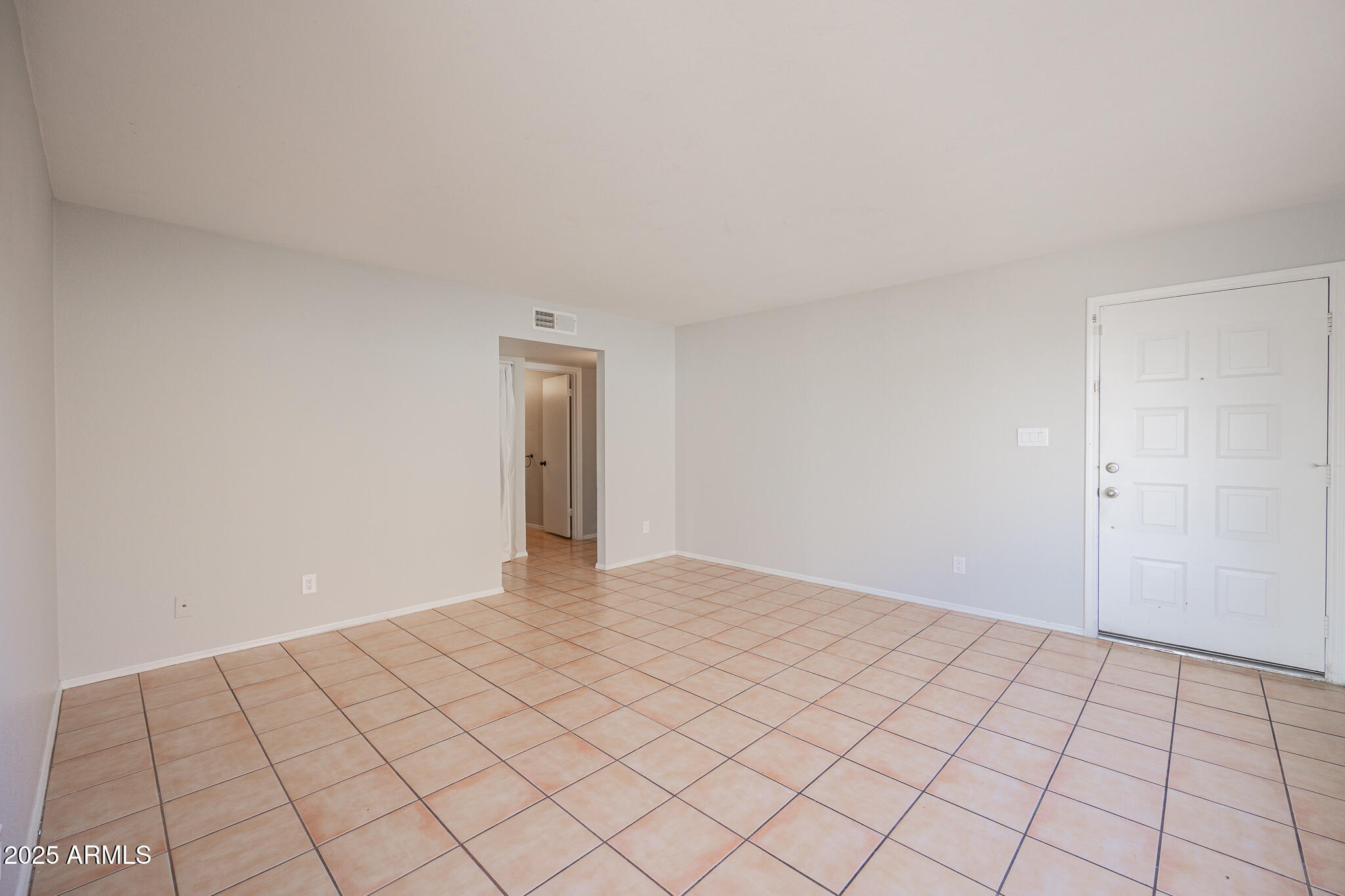2135 South Dorsey Lane Tempe, AZ 85282 - Photo 5 of 24 a view of an empty room and window