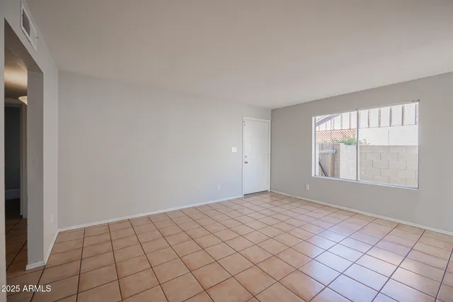 a view of an empty room and window