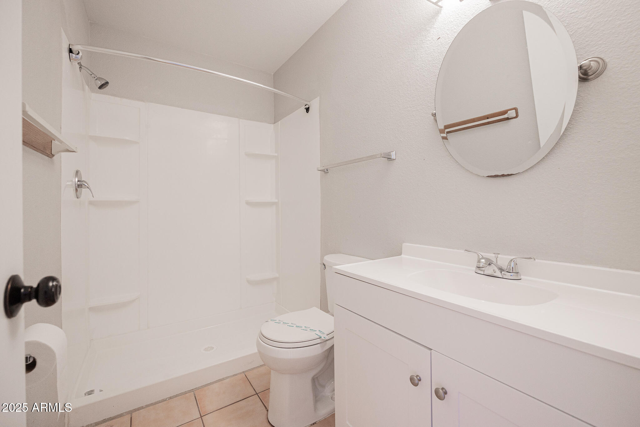 2135 South Dorsey Lane Tempe, AZ 85282 - Photo 10 of 24 a bathroom with a sink a toilet and shower