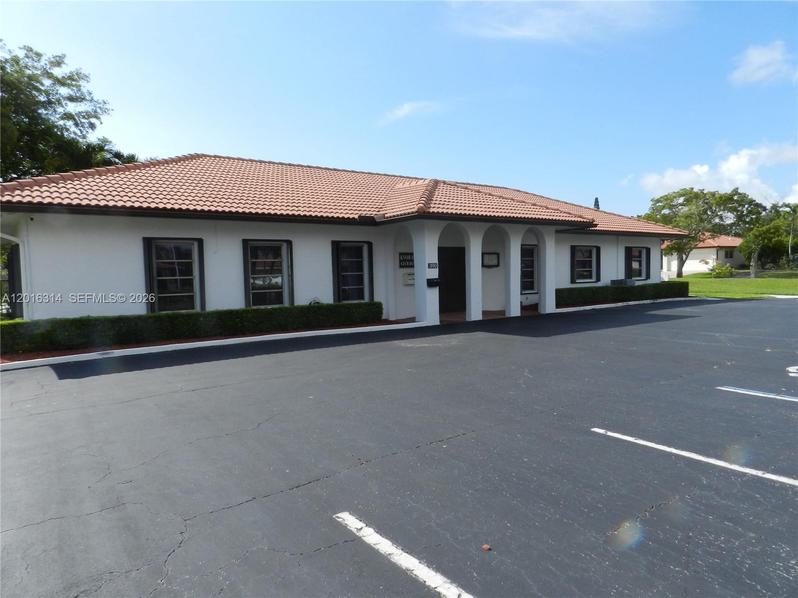 305 Northwest 42nd Street Boca Raton, FL 33431 - Photo 30 of 31 a front view of a house with yard