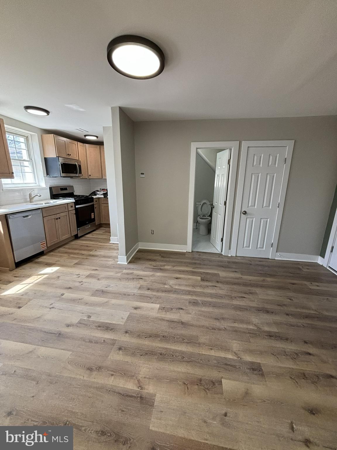 18 West 5th Street, Unit D Media, PA 19063 - Photo 4 of 6 a view of a kitchen with furniture and wooden floor