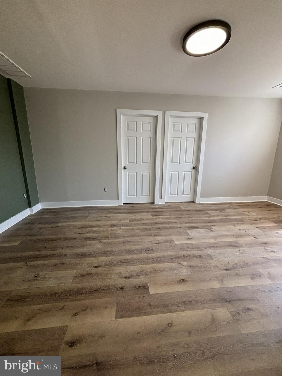 18 West 5th Street, Unit D Media, PA 19063 - Photo 6 of 6 a view of wooden floor and windows in a room