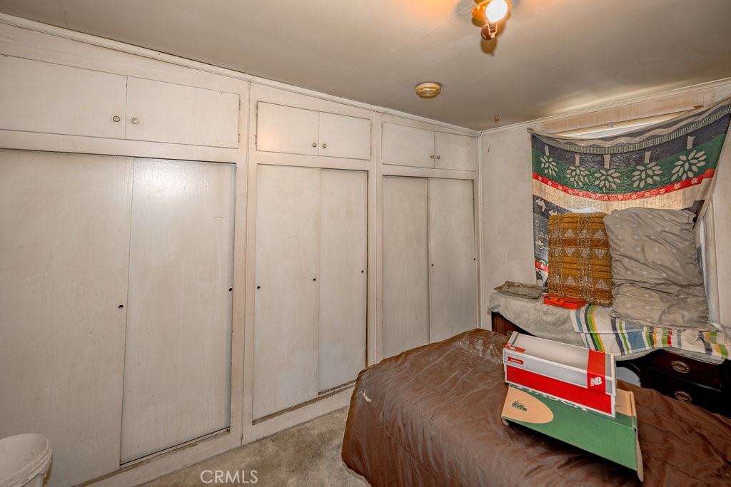 10621 Helendale Avenue Tujunga, CA 91042 - Photo 16 of 20 a bedroom with a bed and a dresser