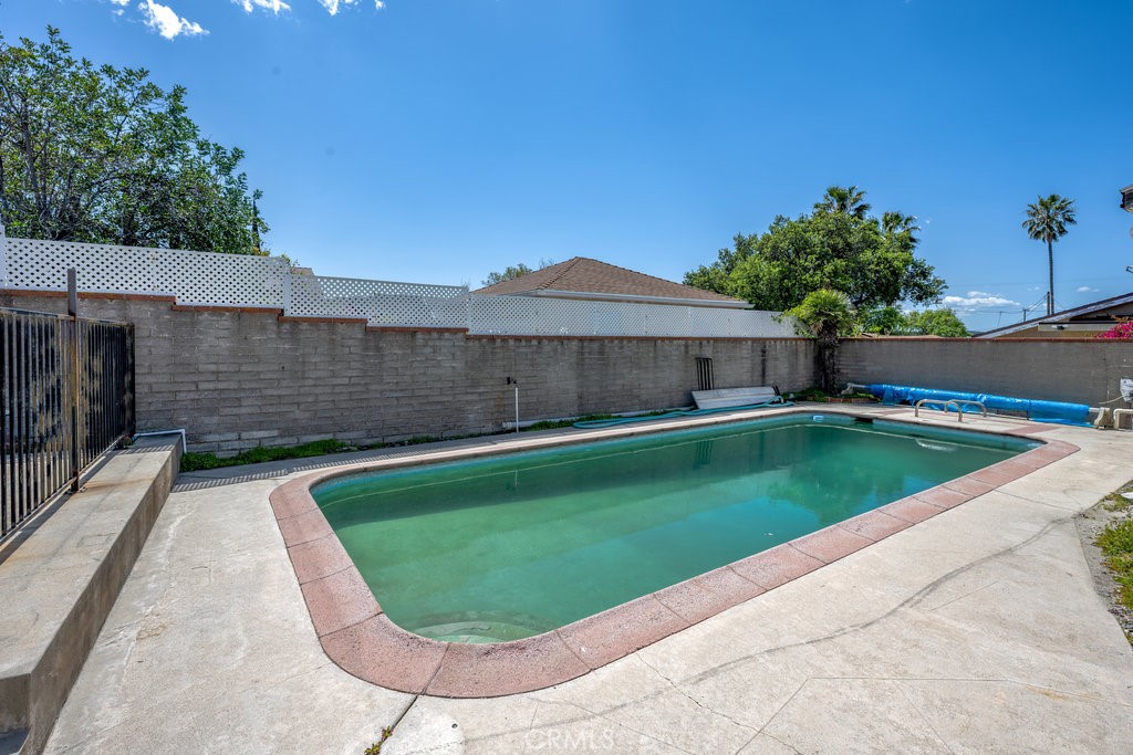 10621 Helendale Avenue Tujunga, CA 91042 - Photo 18 of 20 a view of a swimming pool with a patio