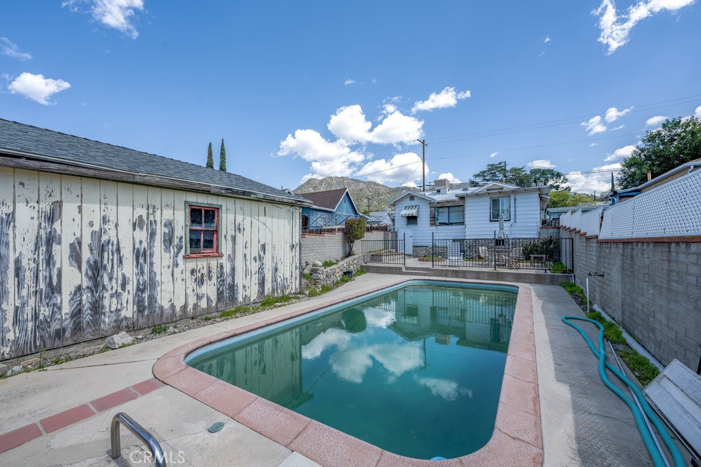 10621 Helendale Avenue Tujunga, CA 91042 - Photo 19 of 20 a view of a swimming pool with a patio