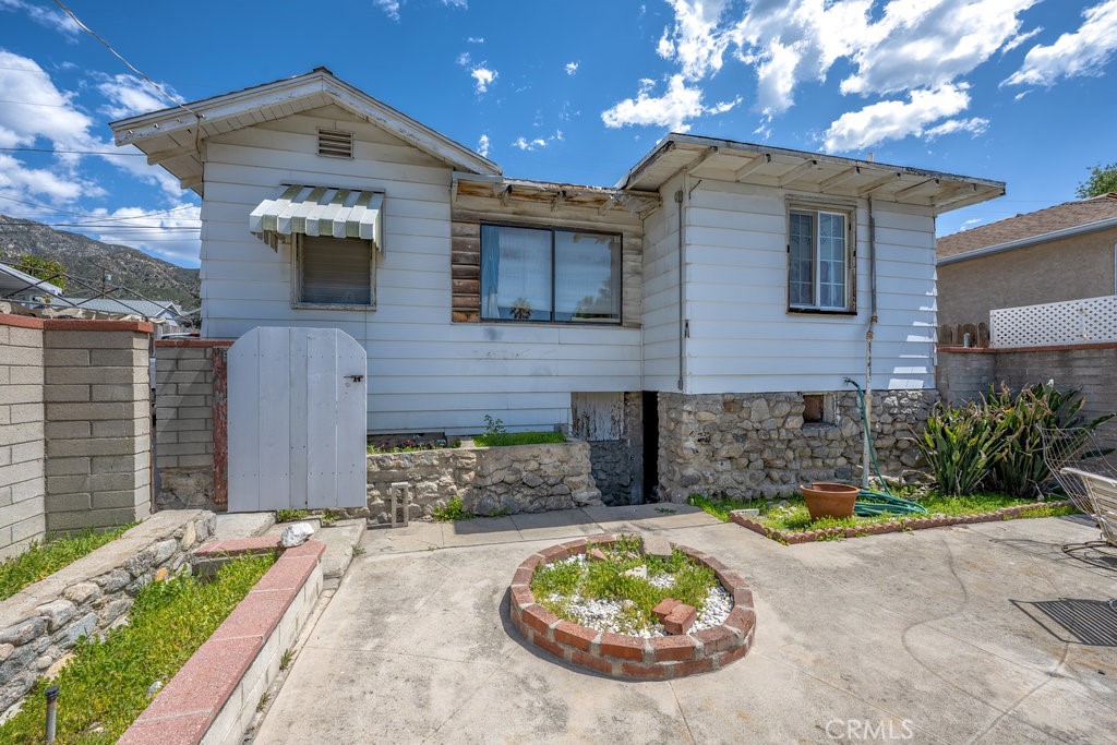 10621 Helendale Avenue Tujunga, CA 91042 - Photo 20 of 20 a view of a house with a yard and sitting area